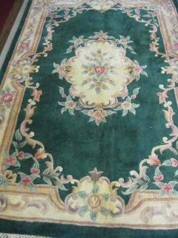 Appraisal: Chinese Handmade Sculptured Wool Rug pastels florals ivory trim green