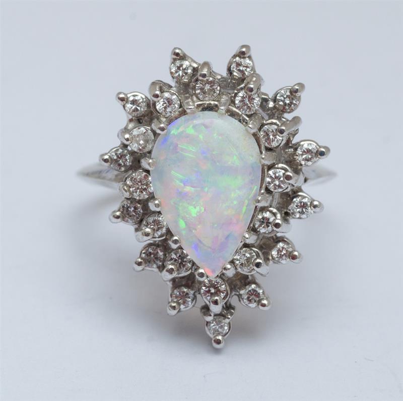 Appraisal: K WHITE GOLD OPAL AND DIAMOND CLUSTER RING The center