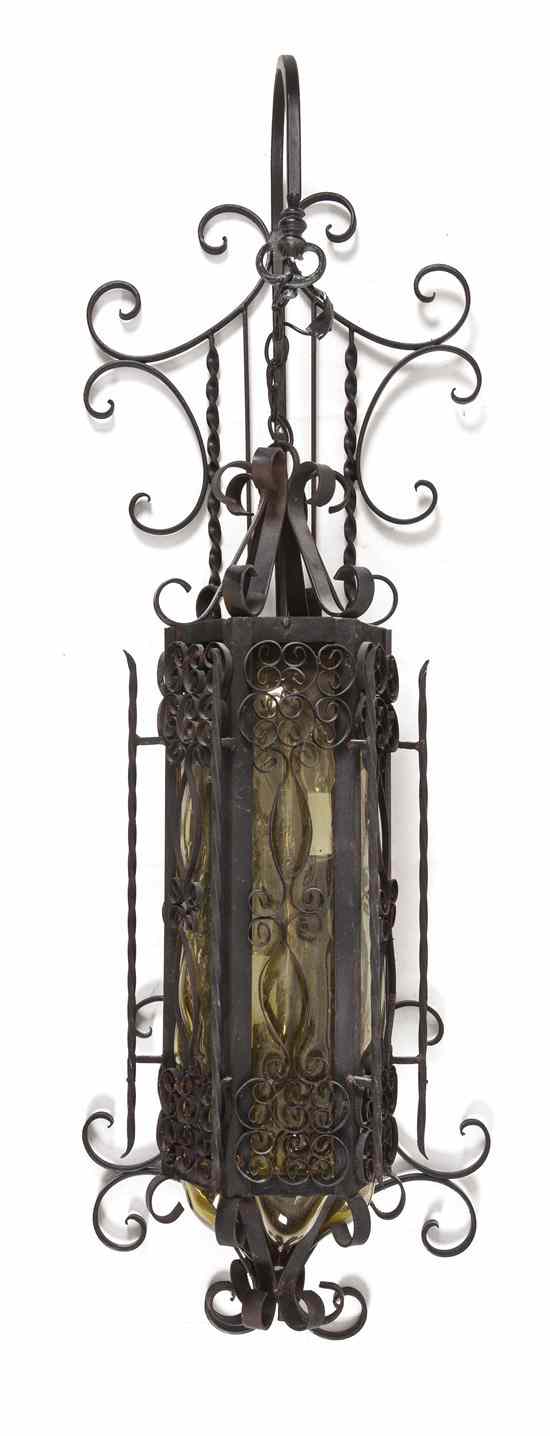 Appraisal: A Continental Wrought Iron Two-Light Sconce having a vertical spindled