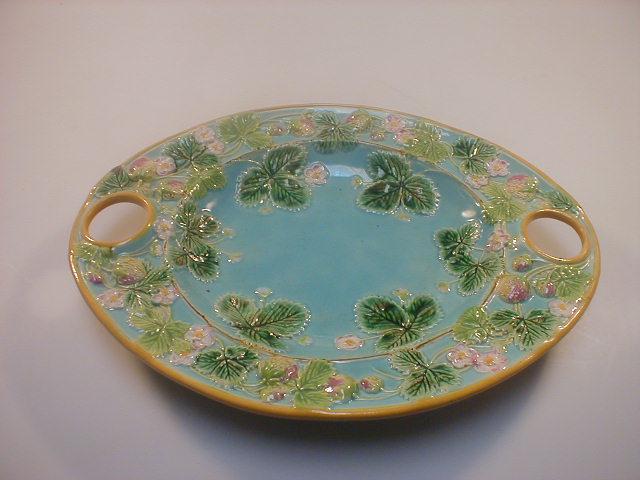 Appraisal: A George Jones majolica strawberry dish of elliptical form with