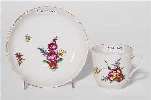 Appraisal: CUP AND SAUCER WITH FLORAL DECORATION Pfalz-Zweibr cken circa Painted