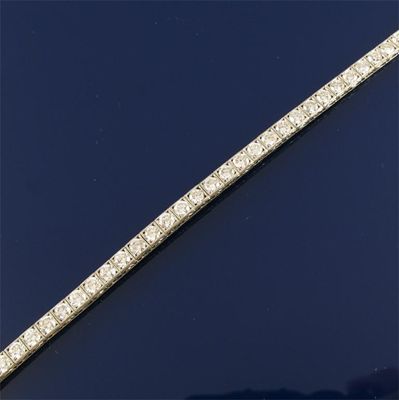 Appraisal: A diamond line bracelet The forty-three brilliant cut diamonds are