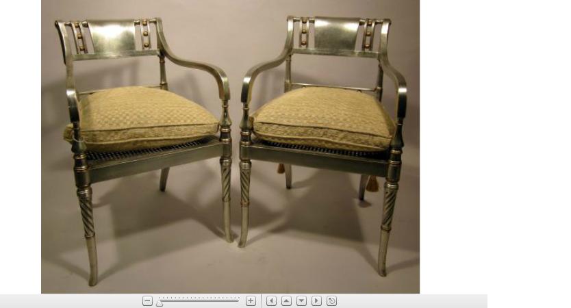 Appraisal: Pair of Regency style silvered armchairsThe curved backs with alternating