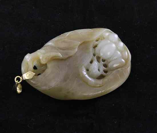 Appraisal: A Chinese pale celadon and russet jade pendant carved as