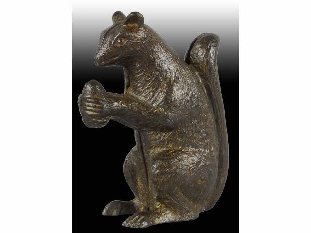 Appraisal: Cast Iron Squirrel with Nut Still Bank Description Made in