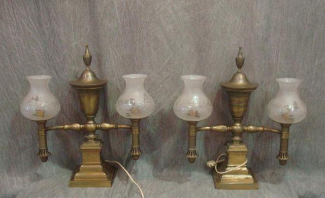 Appraisal: Pair of Arm Gilt Metal Lamps with Etched Shades From