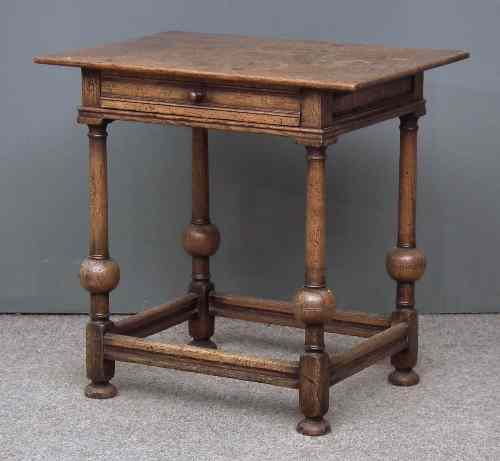 Appraisal: An oak rectangular occasional table of Dutch design fitted single