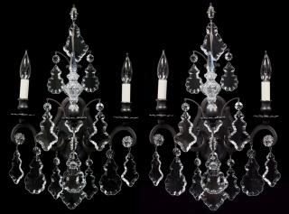 Appraisal: SCHONBEK CRYSTAL AND METAL SCONCES PAIR H W Scrolling metal