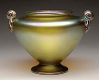 Appraisal: TIFFANY STUDIOS TWO HANDLED URN Iridescent coloring with blue and