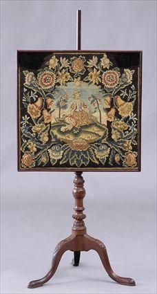 Appraisal: PENNSYLVANIA CHIPPENDALE-STYLE CARVED MAHOGANY TRIPOD POLE SCREEN The adjustable needlework