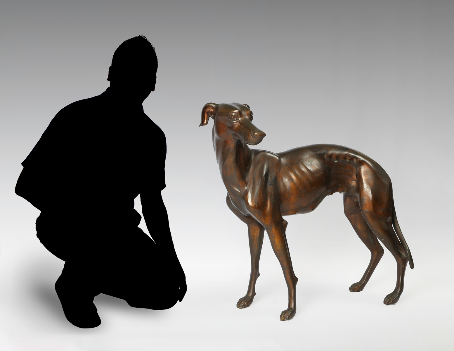 Appraisal: NEARLY LIFESIZE BRONZE SCULPTURE OF A WHIPPET Approximately '' in