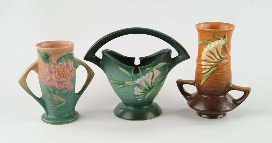 Appraisal: THREE PIECES OF ROSEVILLE POTTERY Freesia vase with two handles