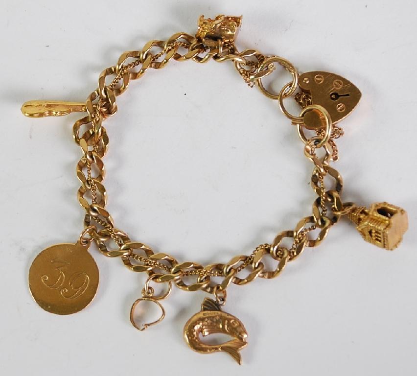 Appraisal: ct GOLD CHARM BRACELET with faceted curb pattern links padlock