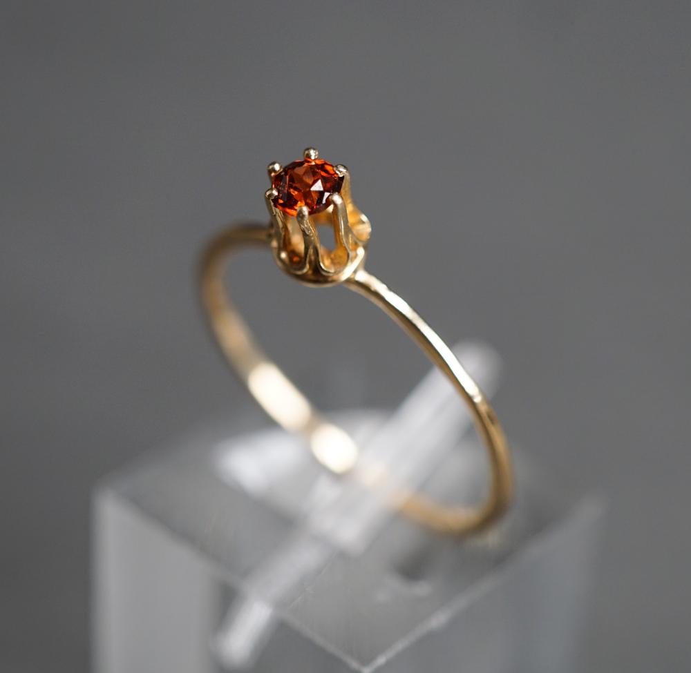 Appraisal: -KARAT YELLOW-GOLD AND GARNET RING GROSS DWT SIZE -Karat Yellow-Gold