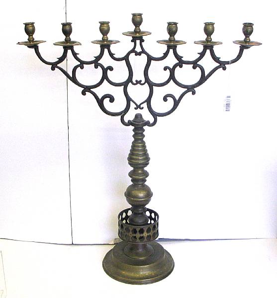 Appraisal: A pair of Baroque style brass seven light candelabra first