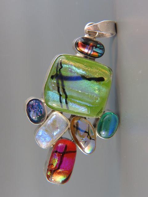 Appraisal: Diochronic Art Glass Pendant rich colors sterling silver long grams