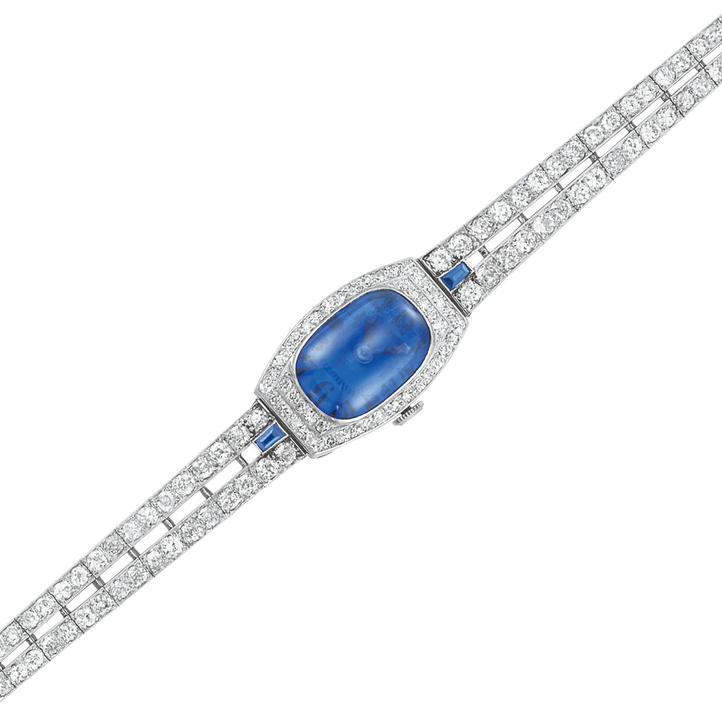 Appraisal: Platinum Cabochon Sapphire Sapphire and Diamond Bracelet-Watch Centering one cushion-shaped