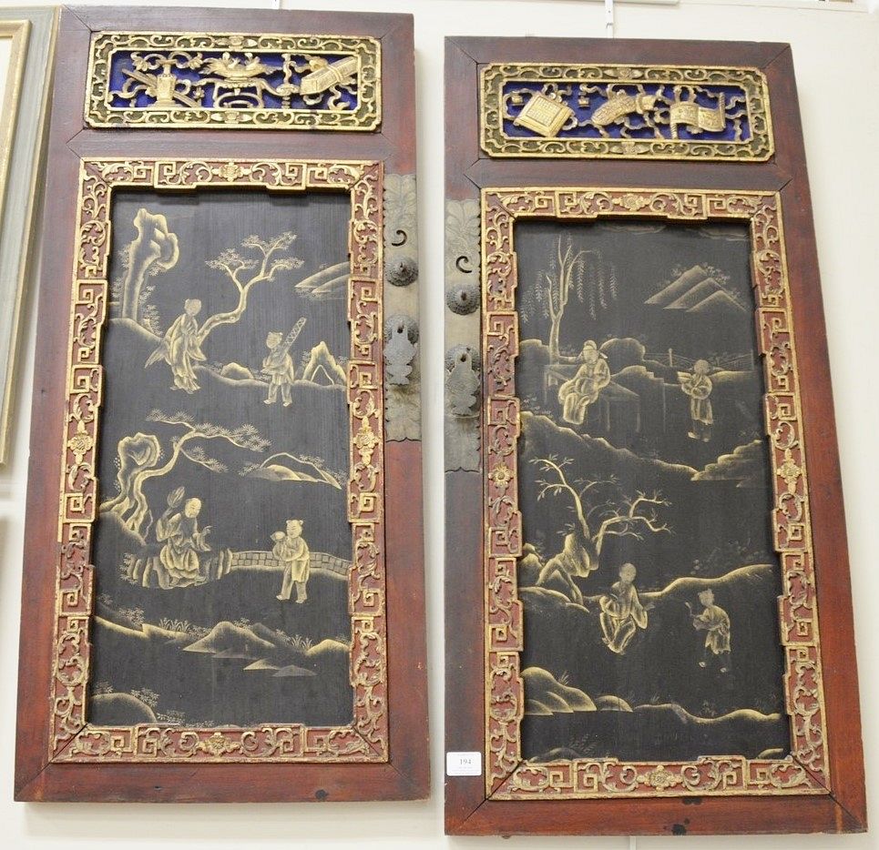 Appraisal: Pair of Chinese carved wood wall hangings with gold painted