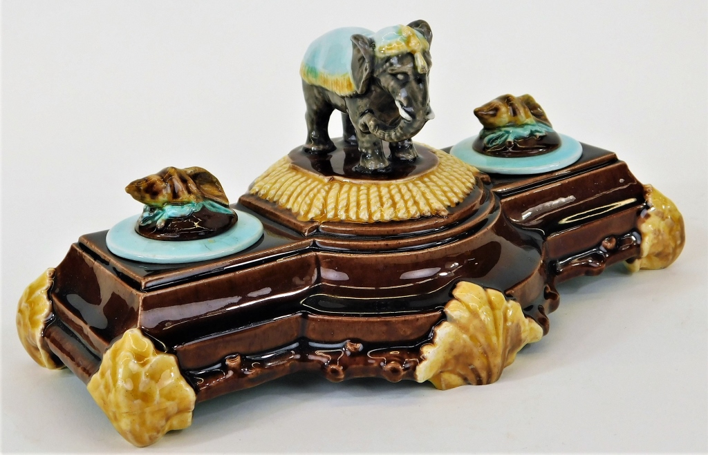 Appraisal: ENGLISH CIRCUS ELEPHANT MAJOLICA POTTERY INKWELL England Late th CenturyTwo