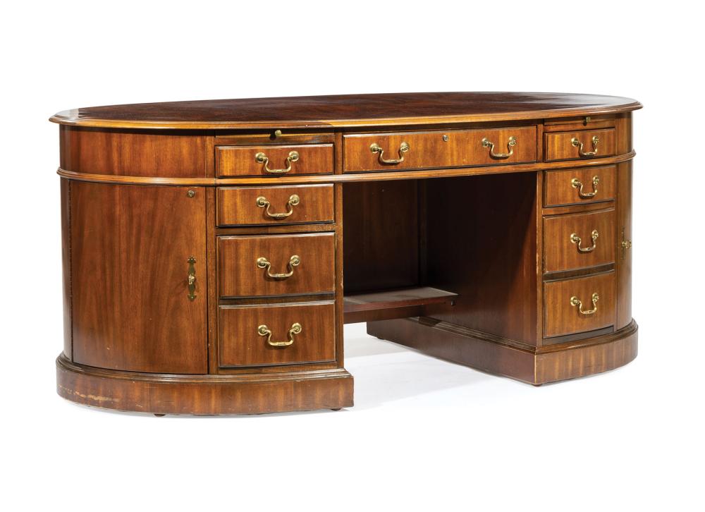 Appraisal: Georgian-Style Mahogany Executive's Desk molded oval top with glass overlay