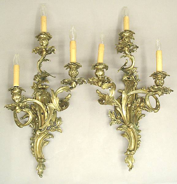 Appraisal: A pair of Louis XV style cast brass three light