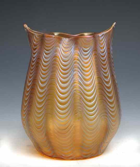 Appraisal: A Loetz iridescent glass vase undulating form and rim high