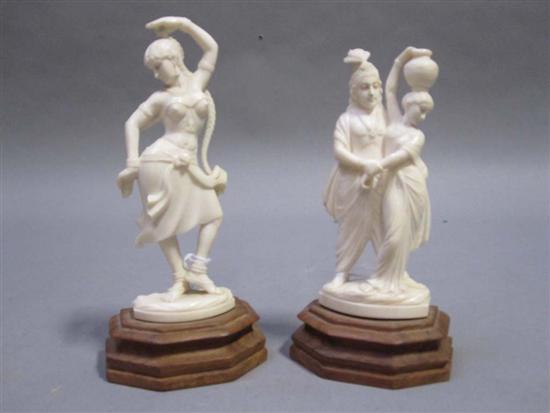 Appraisal: PAIR OF INDIAN CARVED IVORY FIGURES th C One of