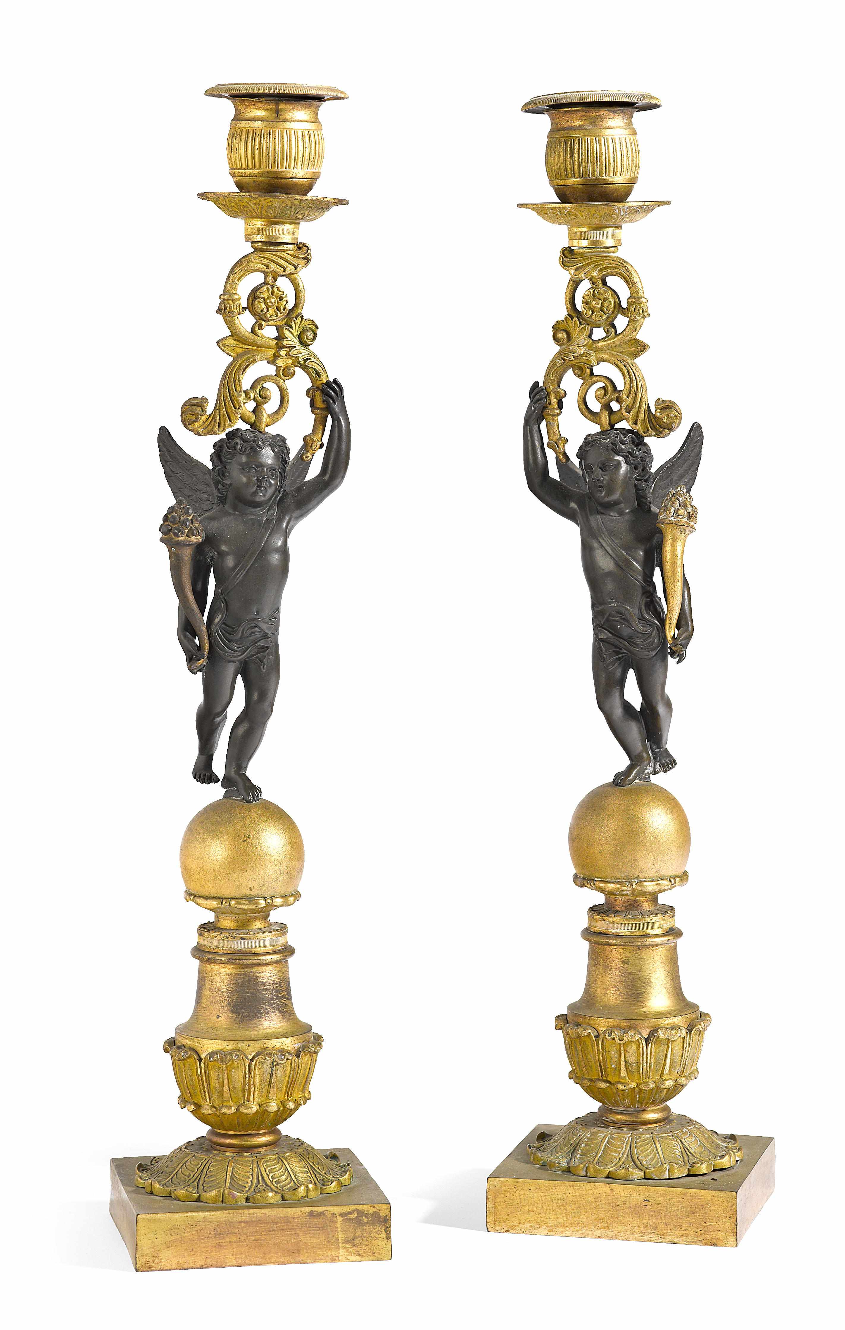 Appraisal: A pair of Empire style gilt and patinated bronze figural