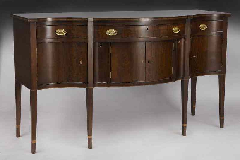 Appraisal: George III style mahogany sideboardwith serpentine shaped front over three