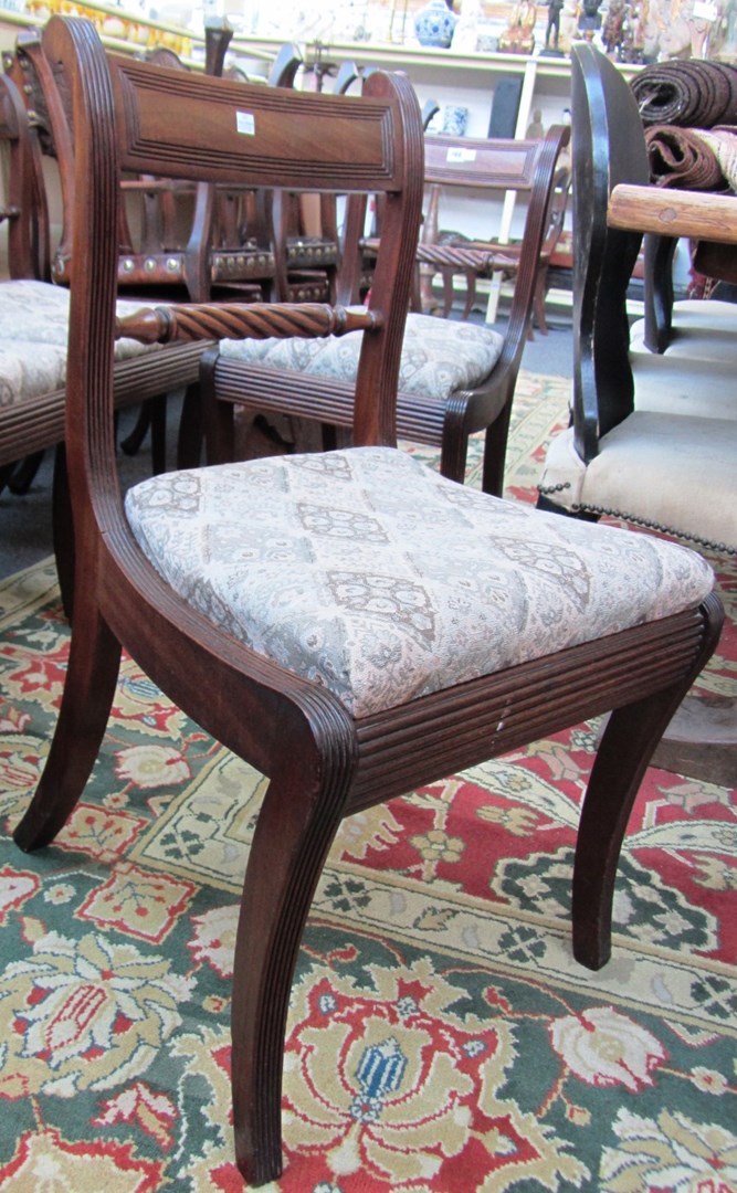 Appraisal: A set of four Regency mahogany dining chairs on sabre