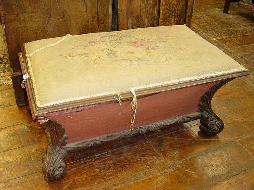 Appraisal: A Victorian mahogany ottoman of sarcophagus form with floral tapestry