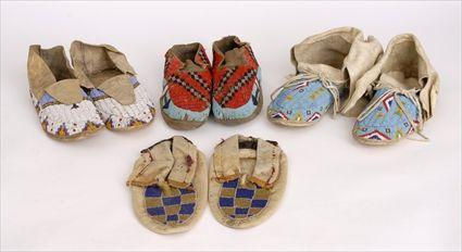 Appraisal: THREE PAIRS OF SIOUX BEADED-HIDE MOCCASINS AND A PAIR OF