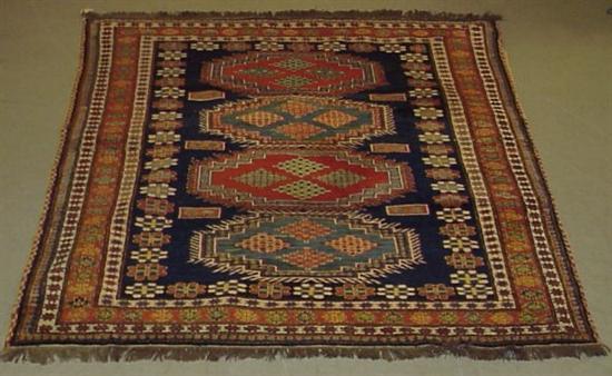 Appraisal: Modern Caucasian-style Peshwar tribal design scatter rug navy field with