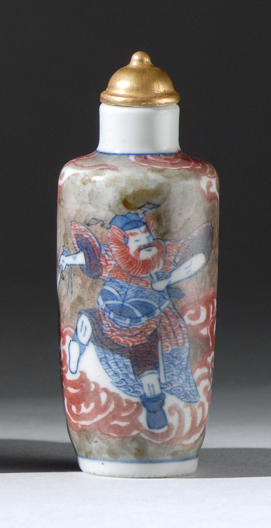 Appraisal: UNDERGLAZE RED AND BLUE PORCELAIN SNUFF BOTTLE Early th CenturyIn