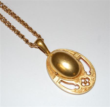 Appraisal: A Victorian gold chain and pendant the oval textured gold