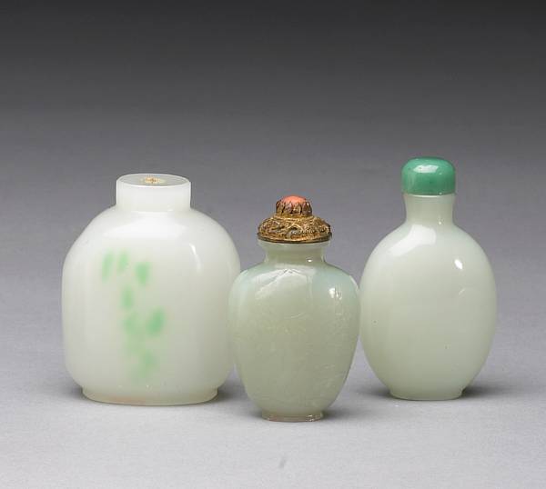 Appraisal: Three simulated jade snuff bottles The first of glass with