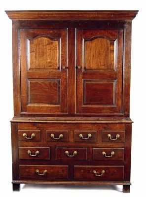 Appraisal: A George III oak press cupboard the moulded cornice above