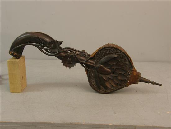 Appraisal: th century Black Forest style carved bellows h in