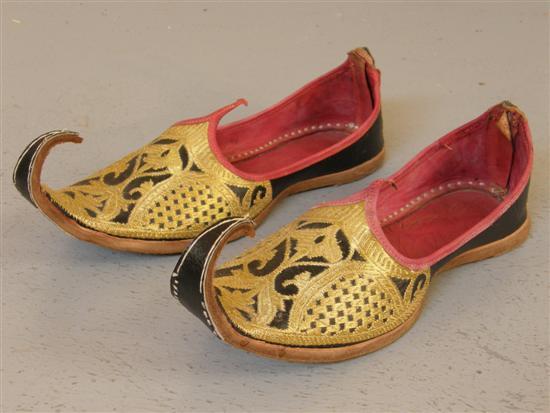 Appraisal: Pair of black cloth and gilt embroidered Indian shoes