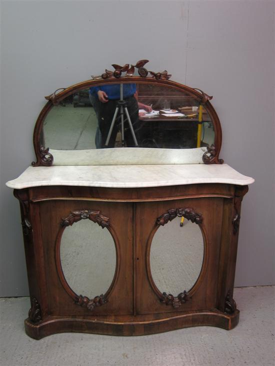 Appraisal: th century rosewood chiffonier with carved mirror back white marble