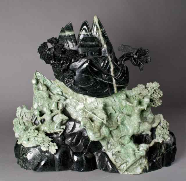 Appraisal: A Massive Chinese Jade SculptureFinely carved to depict five warriors