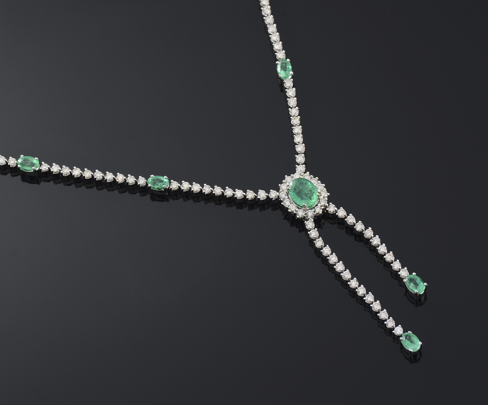 Appraisal: K WHITE GOLD EMERALD AND DIAMOND BOLO NECKLACE Featuring oval