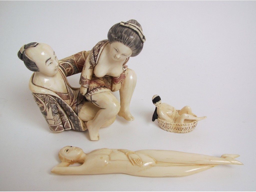 Appraisal: A Japanese erotic carved ivory group of a man and