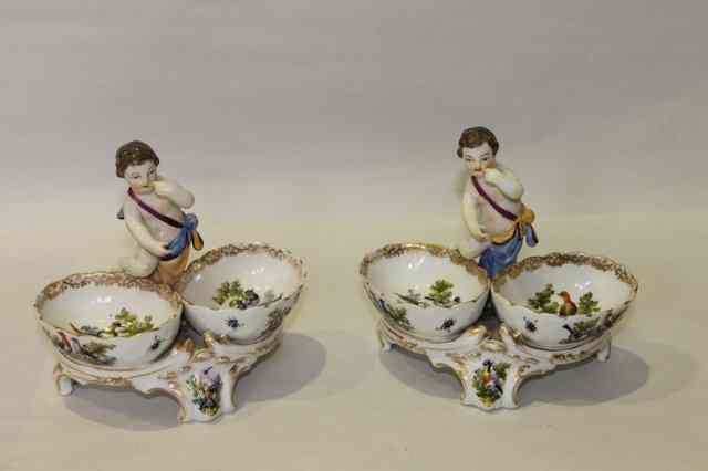 Appraisal: A PAIR OF BERLIN SALTS each with central putti flanked