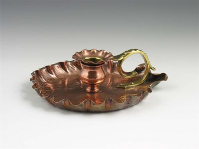 Appraisal: A late th century copper and brass chamberstick in cm