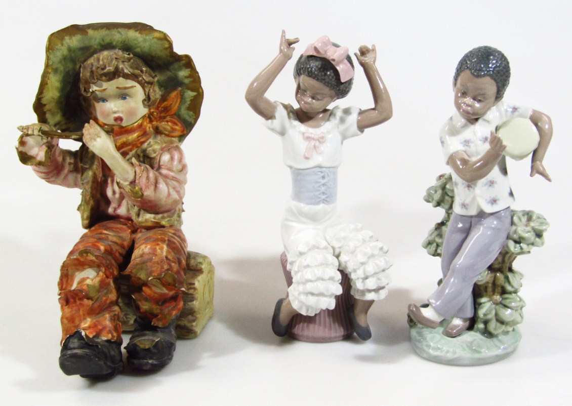 Appraisal: A pair of Lladro figures of child musicians one sat