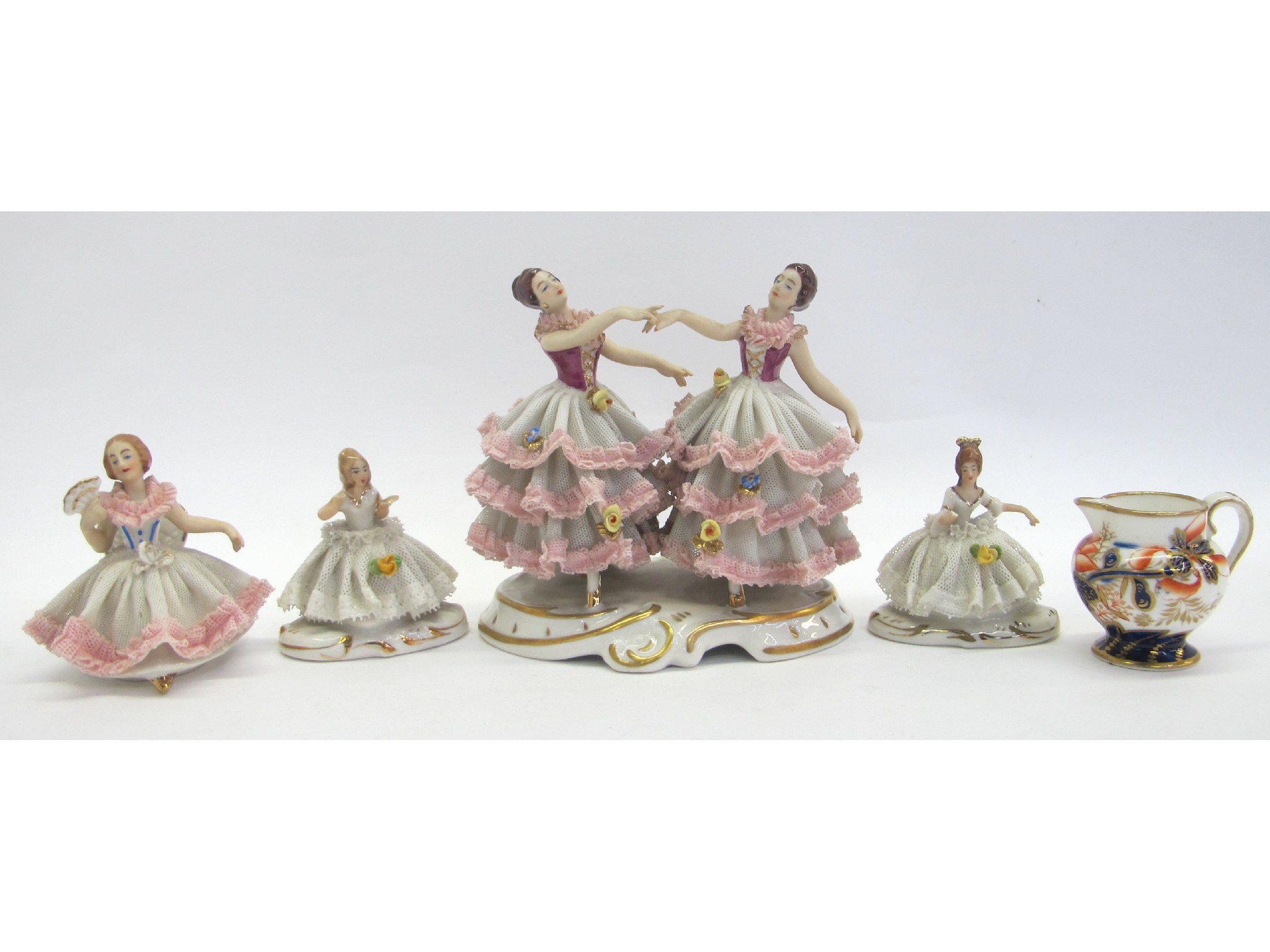 Appraisal: Four Dresden figures of ladies and a miniature Imari jug