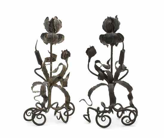 Appraisal: A Pair of Continental Wrought Iron Candlesticks in the form