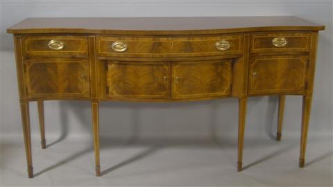 Appraisal: WELLINGTON HALL HEPPLEWHITE STRING INLAID MAHOGANY SIDEBOARD The shaped top