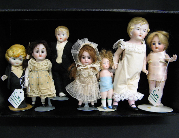 Appraisal: COLLECTION OF SEVEN MINIATURE DOLLS most are bisque includes boy